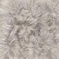 Close-up of a linen-coloured Icelandic sheepskin rug with long, thick, textured wool fibres.