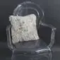 Square Tibetan sheepskin cushion with long, curly cream wool texture resting on a .