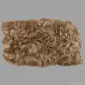 IDR4S Large rectangular rusty brown Icelandic sheepskin rug with long, textured wool pile.