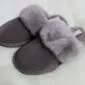 Mink-coloured sheepskin mule slippers with a suede outer and fluffy fur collar.