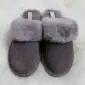 A pair of mink grey suede sheepskin slippers with fluffy fur collars and open heels.