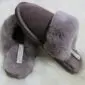Mink-coloured sheepskin slippers with a suede upper and thick fluffy wool lining and collar.