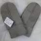 A pair of grey sheepskin mittens with visible stitching and folded cuffs.