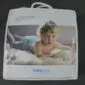 IMG_8317 Soft baby washable lambskin in a white zip-up carry bag with a handle and a picture of a baby on the front.