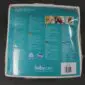 IMG_8318 Reverse side of a teal and white baby lambskin product package with printed care instructions and a barcode.