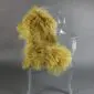 Mustard yellow Mongolian lambskin rug with long, curly wool laid flat.