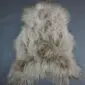 Long-haired Icelandic sheepskin rug in a nude beige tone with natural grey highlights.