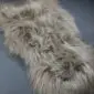 Long-haired Icelandic sheepskin rug in a nude beige tone with natural wavy texture.