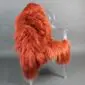 Terracotta orange Icelandic sheepskin rug with long, thick wool laid flat.