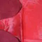Cowhide Rug C00551 (1) Natural shaped cowhide rug dyed in a vibrant red colour with visible hair texture.