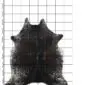 Natural cowhide rug with dark brown and black speckled patterns on a white background.