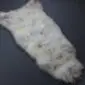 Rare Breed Sheepskin Rug RBL-46 (1) Large rare breed sheepskin rug with long, thick cream and grey wool in a natural pelt shape.
