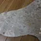 Brown and White Gold Metallic Cowhide Rug CM310 (1) Natural brown and white cowhide rug with metallic gold speckles and an irregular shape. detail view