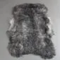 Grey Curly Gotland Sheepskin Rug GOT246 (2) Natural grey sheepskin rug with a thick, curly wool texture and an irregular organic shape.