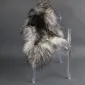 Natural grey Icelandic sheepskin rug with long curly wool laid flat.