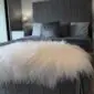 IMG_3162 Long-haired ivory Icelandic sheepskin rug with a natural shape and thick, shaggy wool texture.