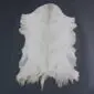 Goatskin Rug GS912 Natural white goatskin rug with grey markings and an irregular shape on a dark grey background.