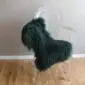 Curly Mongolian Sheepskin Rug Jungle Greene Long-haired, curly jungle green Mongolian lambskin rug laid flat.