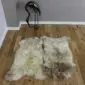 Large double rare breed sheepskin rug with natural cream, grey and brown wool markings.