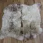 Double rare breed sheepskin rug with long, textured wool in cream, grey and brown tones.