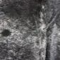 Cowhide Rug C00755 (2) Close-up of a speckled cowhide rug featuring a natural salt and pepper pattern in black, grey and white tones.