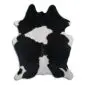 Natural cowhide rug with a black and white speckled pattern and irregular organic shape.