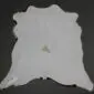 Calfskin Rug CF129 (2) Natural light grey calfskin rug with an irregular organic shape and short hair texture on a dark background.