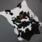 Calfskin Rug CF129 (8) Natural calfskin rug with white and black speckled markings and a small brown patch in the centre.
