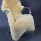 Yellow medical Relugan sheepskin rug with dense, short-pile wool laid flat.
