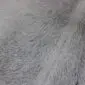 Close-up of a grey cowhide rug showing the natural hair texture and tonal variations.