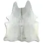 Natural cowhide rug in light grey and white with an irregular organic shape.