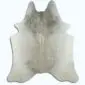 Natural cowhide rug in light grey and white with an irregular organic shape.