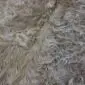 Cowhide Rug C00857 (3) Close-up of a caramel and white cowhide rug showing natural hair texture and colour variations.
