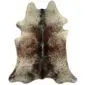 Natural cowhide rug with grey, brown and white speckled patterns and a dark central spine stripe.