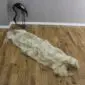 Long double rare breed sheepskin rug with natural cream, grey and brown wool tones.