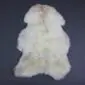 Rare Breed Sheepskin Rug RBS122a Natural cream rare breed sheepskin rug with light brown and grey markings in a traditional pelt shape.