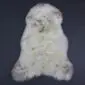 Rare Breed Sheepskin Rug RBS126a Natural cream rare breed sheepskin rug with light brown and grey speckles and a thick, textured wool pile.