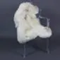 Cream rare breed sheepskin rug with long wool pile laid flat.