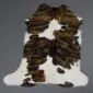 Natural calfskin rug with a white base and dark brown brindle patterned patches.
