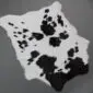 Calfskin Rug CF159 (3) Natural calfskin rug with a white base and irregular black spots and patches. detail view