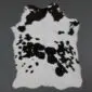 Natural calfskin rug with black and white speckled markings and an irregular organic shape.