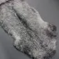 Double-length natural grey Gotland sheepskin rug with curly wool texture and organic shape.