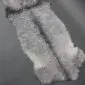 Natural grey double Gotland sheepskin rug with curly wool texture and organic shape.