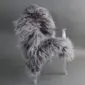 Large grey Icelandic sheepskin rug with long, thick wool laid flat.