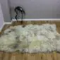 Rare-Breed British Sheepskin Quad RB4S-182 (5) Large quad sheepskin rug with long, thick wool in natural cream and grey tones on a wooden floor.