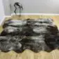 Rare-Breed Sheepskin Rug 6 Skin RBS6S-76 (4) Large six-skin rare breed sheepskin rug with natural grey, brown, and cream mottled wool on a wooden floor. detail view