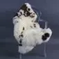 Rare Breed Sheepskin Rug RBM-83 (1) Natural cream sheepskin rug with dark brown spots laid flat.