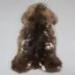 Large rare breed sheepskin rug with thick, textured wool in mottled shades of dark brown, tan, and cream.