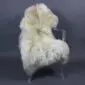 Large cream and ivory rare breed sheepskin rug with long, thick wool laid flat.
