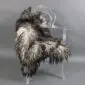 Natural grey Icelandic sheepskin rug with long curly wool laid flat.